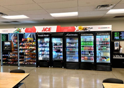 Deluxe micro market retail setup at Ace Hardware with branded vending graphics and shelving