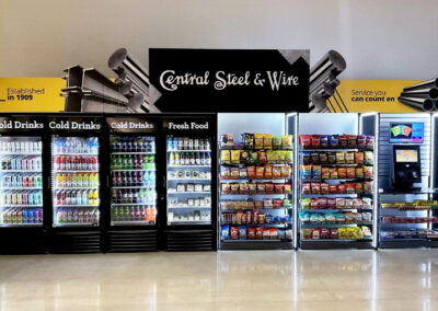 Deluxe vending installation at Central Steel & Wire with branded micro market wraps