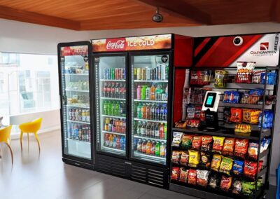 Deluxe micro market by Coley Canteen with snack shelving and cooler setup