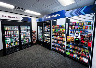 Deluxe micro market station at Enerflex with branded coolers and snack shelves