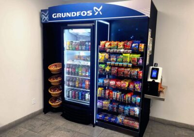 Deluxe micro market installed at Grundfos with branded displays and coolers
