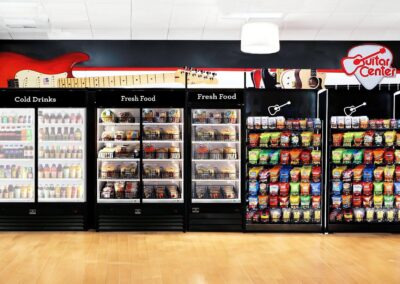 Deluxe micro market display at Guitar Center with custom shelving and branded wraps
