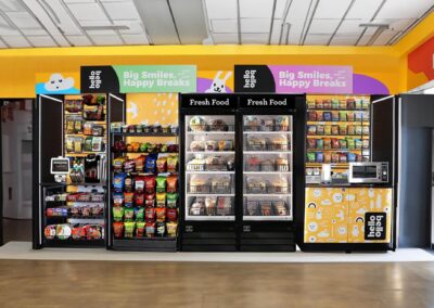 Deluxe vending fixture with Hello Bello branding and modular snack shelf setup