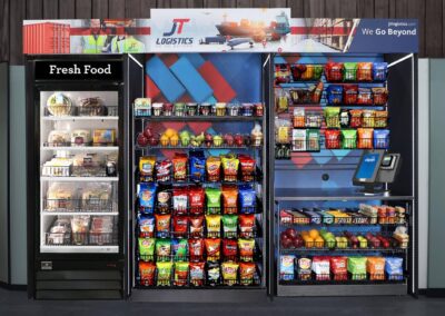 Deluxe vending fixture at JT Logistics with micro market shelves and full wrap graphics