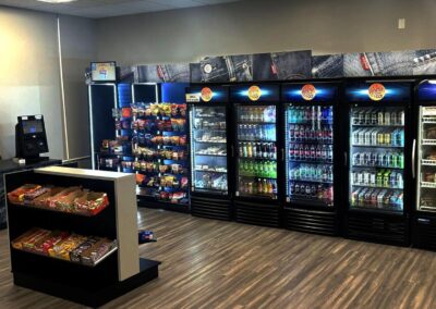 Deluxe micro market unit with Levi Strauss branded coolers and product shelves