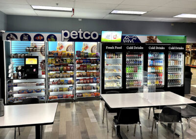 Deluxe micro market display at Petco with snack shelves and branded drink stations