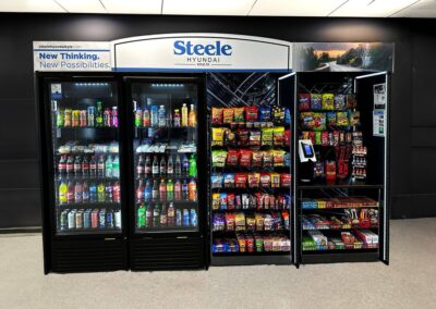 Deluxe micro market installed at Steele Hyundai with vending coolers and snack shelves