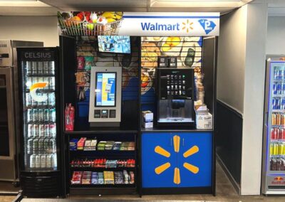 Deluxe micro market fixture at Walmart with coolers, retail graphics, and shelving