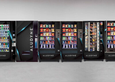 Vending machine display at Aludyne with a row of snack and drink machines