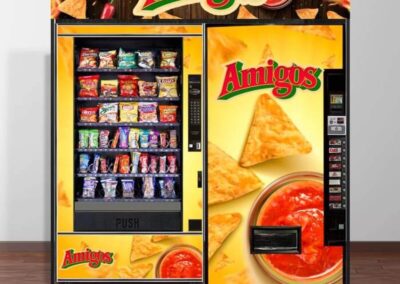 Custom vending machines wrapped with Amigos branding and snack graphics