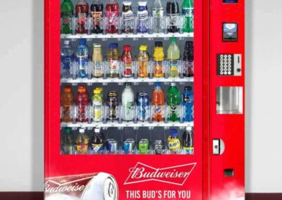 Red Budweiser vending machine with branded cooler graphics and drink merchandiser