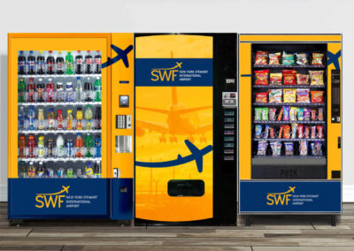Vending - SFW Airport vending machines with orange and yellow SWF Airport branded graphics